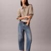 Blugi cropped cu croi evazat
