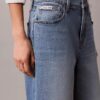 Blugi cropped cu picior larg