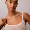 Body-ul minimalist din plasă până la jumătatea coapsei