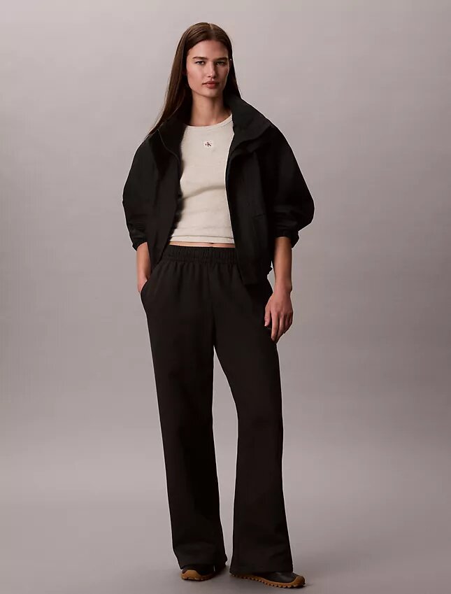 Pantaloni de trening din fleece cu croi larg Monologo Pantaloni de trening din fleece cu croi larg Monologo