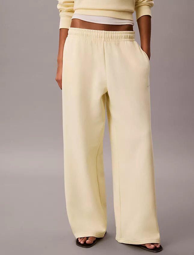 Pantaloni de trening din fleece cu croi larg Monologo Pantaloni de trening din fleece cu croi larg Monologo