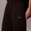 Pantaloni de trening din fleece cu croi larg Monologo Pantaloni de trening din fleece cu croi larg Monologo