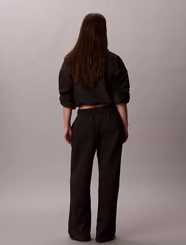 Pantaloni de trening din fleece cu croi larg Monologo Pantaloni de trening din fleece cu croi larg Monologo