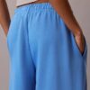 Pantaloni de trening din fleece cu croi larg Monologo Pantaloni de trening din fleece cu croi larg Monologo