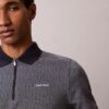 Tricou polo cu fermoar și model în zig-zag