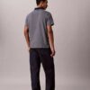 Tricou polo cu fermoar și model în zig-zag