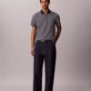 Tricou polo cu fermoar și model în zig-zag