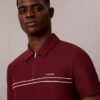 Tricou polo cu fermoar pe un sfert și bordură contrastantă