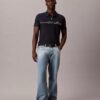 Tricou polo cu fermoar pe un sfert și bordură contrastantă