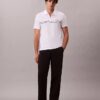 Tricou polo cu fermoar pe un sfert și bordură contrastantă