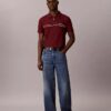 Tricou polo cu fermoar pe un sfert și bordură contrastantă
